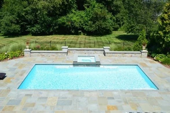 Rectangular pool with integrated spa